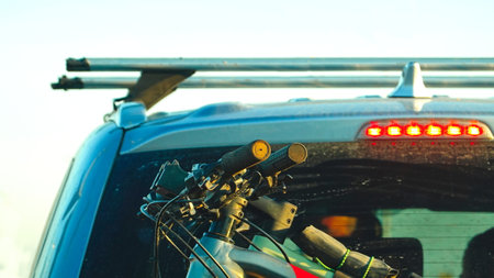 Bicycles on trunk. Car is transporting bicycles on rack. Bikes on the trunk