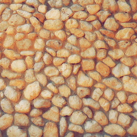 A wall of round cobblestones in concrete. Home Design Decision. Web Bannerの写真素材