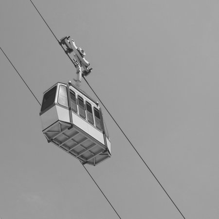 Cable car with blue Sky in the background in Rosh Hanikra, located at north of Israel. black and...
