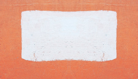 Photo of a concrete painted wall. In the center is a rectangular painted area. Natural background, backdrop.の写真素材