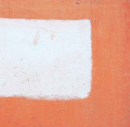 Old red wall with painted part. Background. place for textの写真素材