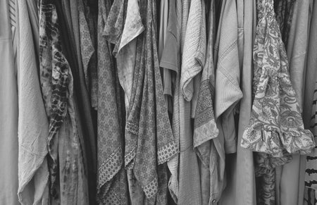 Clothing on Hanger at the Modern shop Boutique. Summer Dresses. Wallpaper. Black and whiteの写真素材