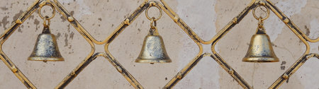 Three Rustic Cowbells. Iron Decorative Hanging Bells with tarnished brass finish. Home design.の写真素材