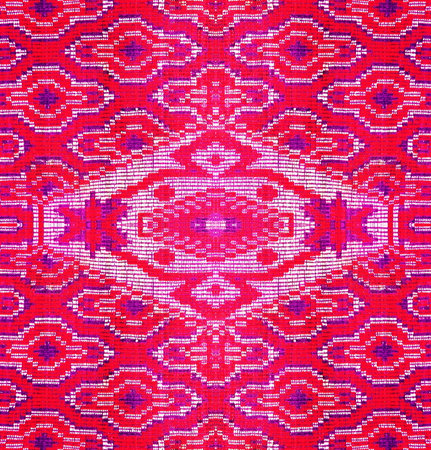 An attractive vintage wallpaper showcases a carpet pattern with a bright pink ornament against a...