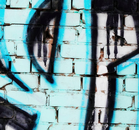 Graffiti Title on White Brick Wall