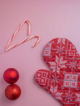 Merry christmas mint canes, red ball and winter glovesの写真素材