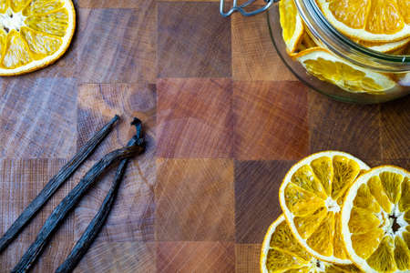 Dehydrated orange, Vanilla beans, Macadamia nuts on table