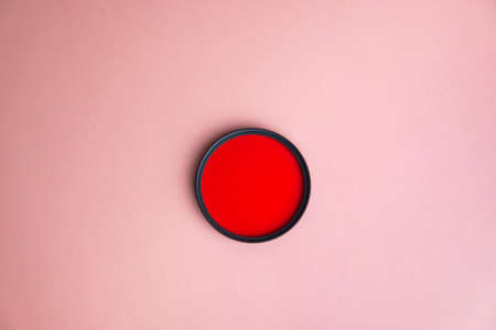 Red lens filter, on the pink backgroundの写真素材