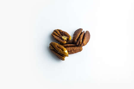Pecan nuts isolated on white background.
