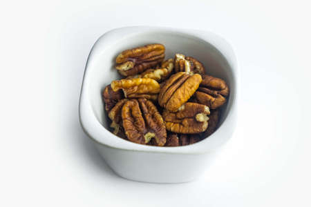 Pecan nuts isolated on white backgroundの写真素材