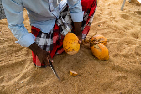coconut seller on the beachの写真素材