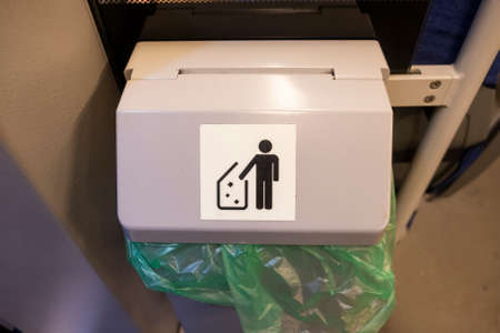 Garbage container in electric train in Moscow, Russia.