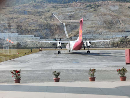 16th November, 2021 at Pakyong Airport, Sikkim, India. The plane is on the platform preparing for the next flight at Pakyong Airportのeditorial素材
