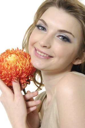 Beautiful portrait of a young sexy woman with a bright flower.の写真素材