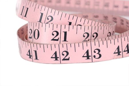 Pink measuring tape isolated over white