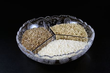 A glass bowl full of rice and bulgur wheatの写真素材