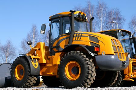 New, shiny and modern orange dozer machine. Construction industry machinery.