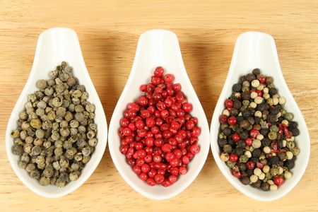 Closeup of pepper grains in four different colors