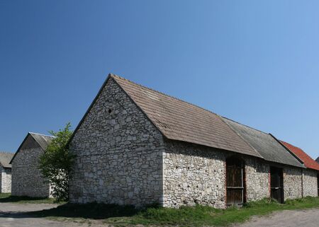 Polish countryside. Rural architecture. Old stonework - vintage barns and warehouses.の写真素材