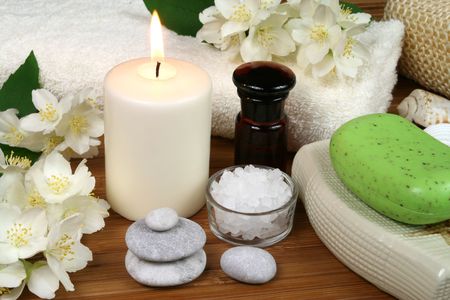 Spa resort therapy composition - jasmine flowers, soap, candle and salt crystalsの写真素材