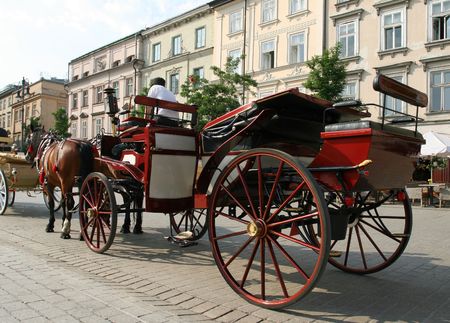 Horse drawn carriage - tourist attraction at Krakow City Square. Poland.の写真素材