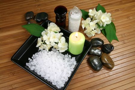 Spa resort therapy composition - jasmine flowers, candle and salt crystalsの写真素材