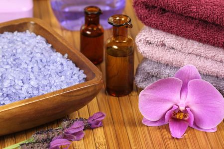Spa relaxation composition - bath soap, towels, orchid flower, bottles with lotionsの写真素材