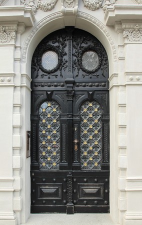 Ornamental wooden door in Prague, Czech Republicの写真素材