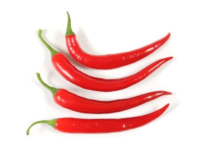 Red, fresh cayenne peppers. Vegetables isolated on white.