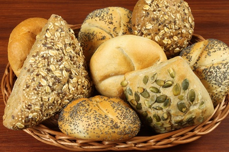 Different kinds of bread in wicker basket.