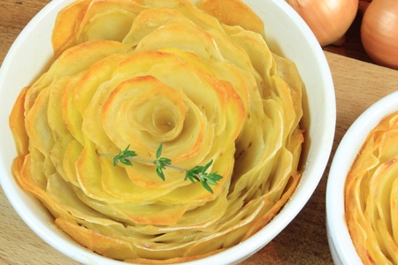 Delicious fancy food - crispy potato roast flowers. Potato dish.の写真素材