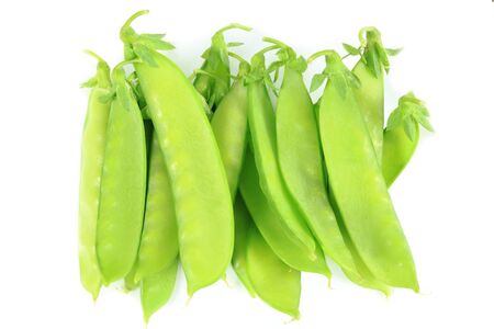 Vegetables - fresh, sweet, green peas on white.の写真素材