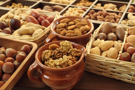 Varieties of nuts: peanuts, hazelnuts, chestnuts, walnuts,  pistachio and pecans.