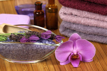 Spa relaxation composition - bath soap, towels, orchid flower, bottles with lotionsの写真素材