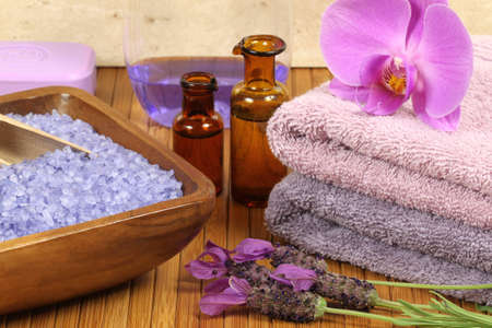 Spa relaxation composition - bath soap, towels, orchid flower, bottles with lotionsの写真素材