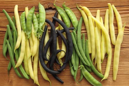 Various assortments of beans on wooden backgroundの写真素材