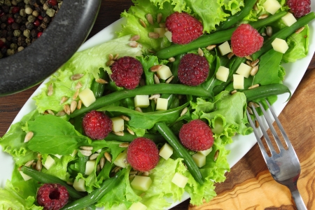 Salad with green beans, cheese and raspberries の写真素材
