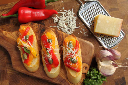 Crostini, small toasts with colored peppers and spices.の写真素材