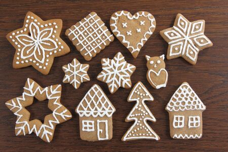 Gingerbread cookies on wooden background. Christmas decoration.