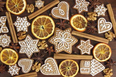 Gingerbread cookies on wooden background. Christmas decoration.