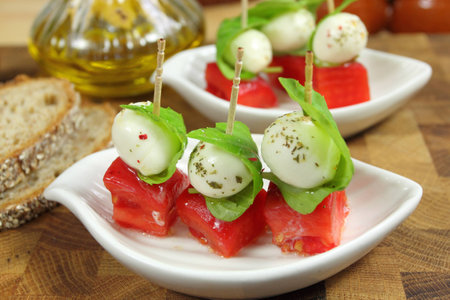 Appetizer with mozzarella, tomato and basil.の写真素材