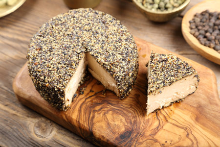 Ripened goat cheese with grains of black pepper.の写真素材