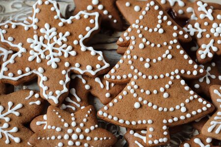 Christmas homemade gingerbread cookies on wooden table.の写真素材