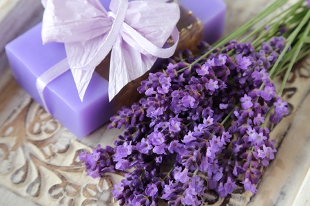 Bouquet of lavender and lavender soap on a wooden background.の写真素材