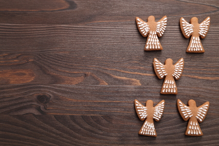Christmas homemade gingerbread cookies on wooden background. Sweet food.の写真素材