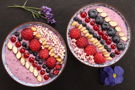 Blueberry smoothie bowl with raspberries, currants, pine nuts, blueberries, millet gruel.の写真素材