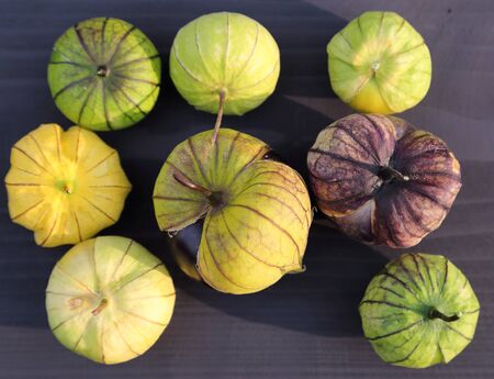 Tomatillo on wooden board. Edible fruits.