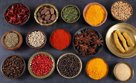 Herbs and spices in metal bowls. Food and cuisine ingredients. Colorful natural additives.の写真素材