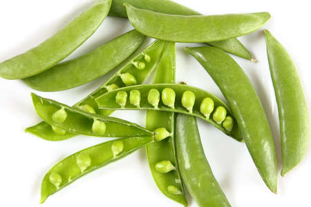 Sweet green peas on a white background. Top view.の写真素材