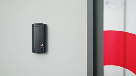 Lublin, Poland - November 2017: Close up of a woman using a modern intercom at a residential building entrance.のeditorial素材